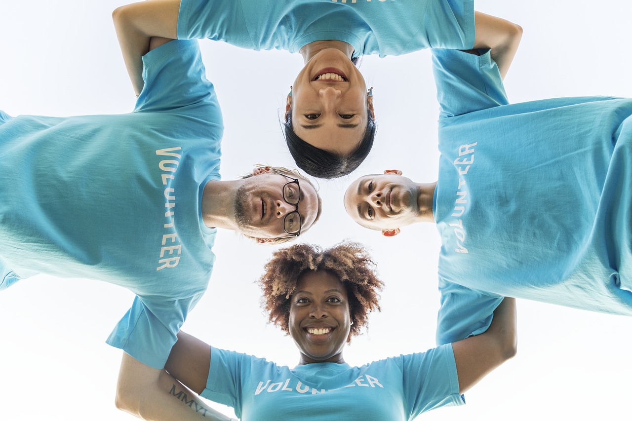 nonprofit organization volunteers in a circle